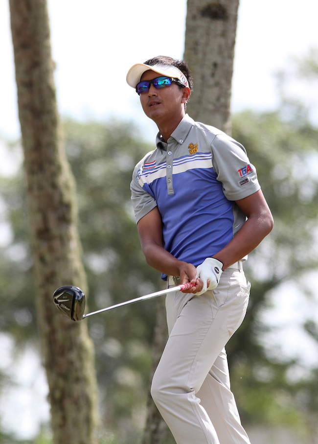 Thai Sadom Kaewkanjana watches his drive on No. 7 en route to a 67 and the lead
