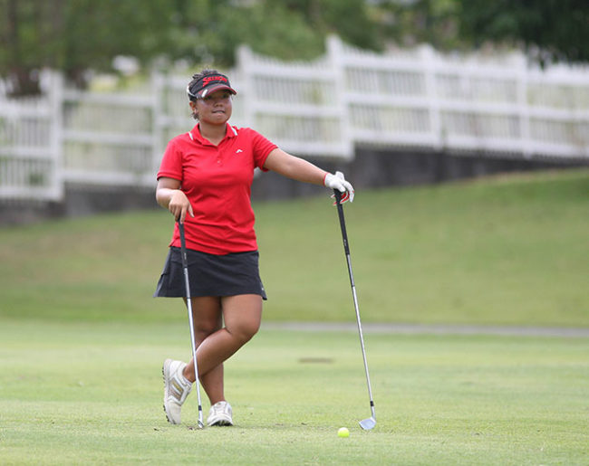 Harmie Constantino weighs down her options on what club to use on her approach to No. 2.