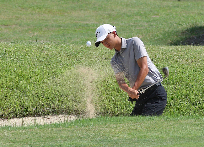  Peter Po hits a bunker shot on No. 14