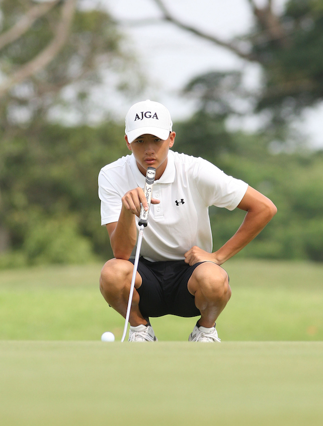 Peter Po studies the line of his putt on No. 9