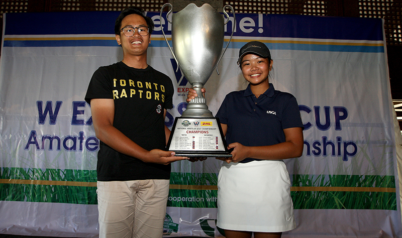 Jolo Magcalayo (left) and Junia Gabasa hold the huge W Express RVF Cup trophy after topping their respective divisions in contrasting fashions.