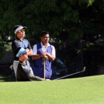 aidric chan fires in bunker in hole 4 while ira alido  watching