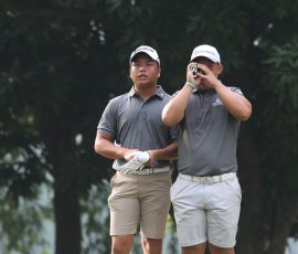 alido watching while wong using the yardage in hole 3