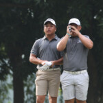 alido watching while wong using the yardage in hole 3