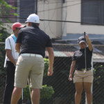 harmie constantino making alingment of his putt foreground his flight mate macalaguim gabriel