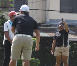 harmie constantino making alingment of his putt foreground his flight mate macalaguim gabriel