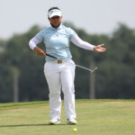 harmie constantino ready to putt in hole 6