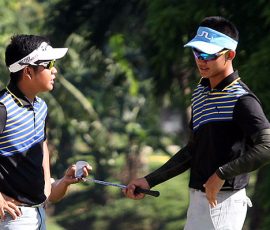 ira alido(left) and aidric chan after bunker shots in hole  4