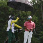 rupert zaragosa discused their next shots with his caddie