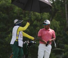 rupert zaragosa discused their next shots with his caddie